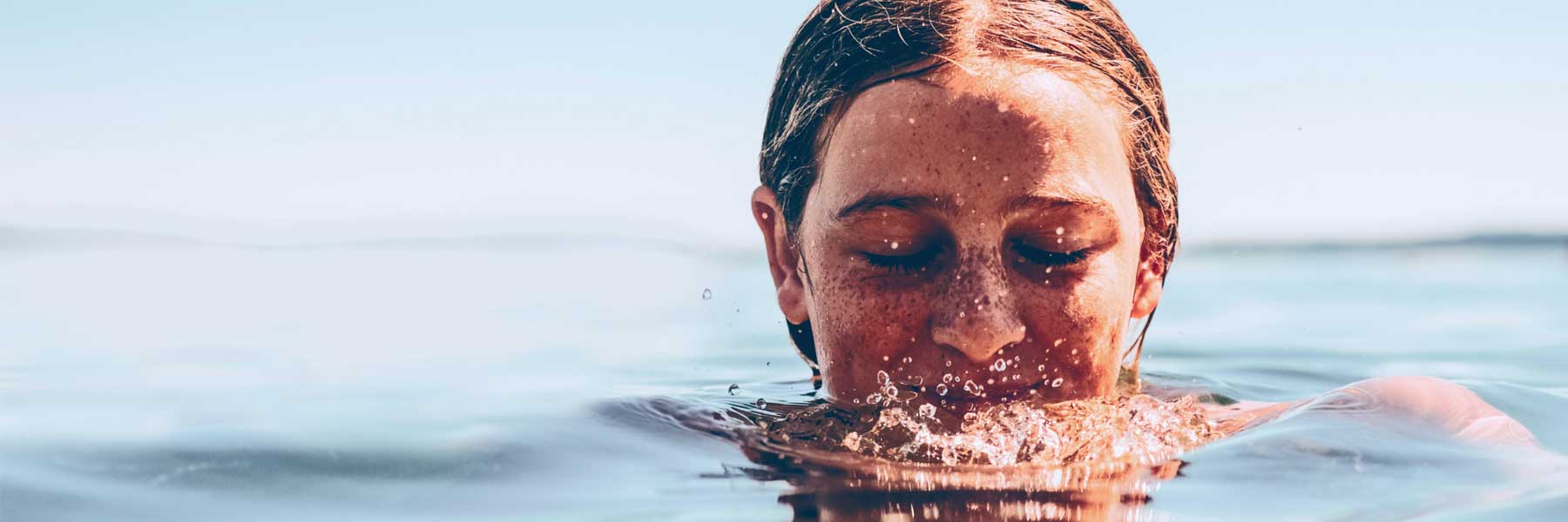 woman swimming in lake