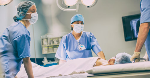 A child being wheeled into the operating room.