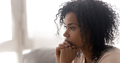 Woman with lupus experiencing cognitive dysfunction.