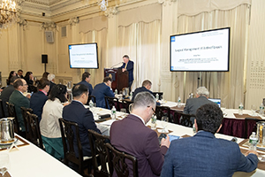 Photo of many physician sitting at tables during the meeting