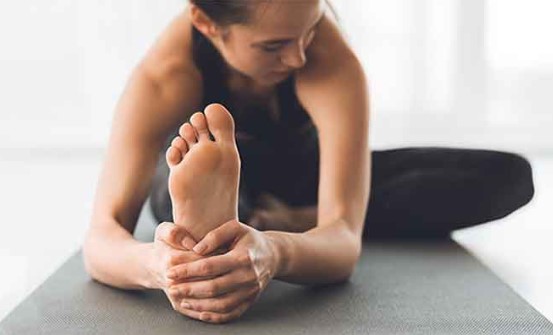 A woman holding her heel.