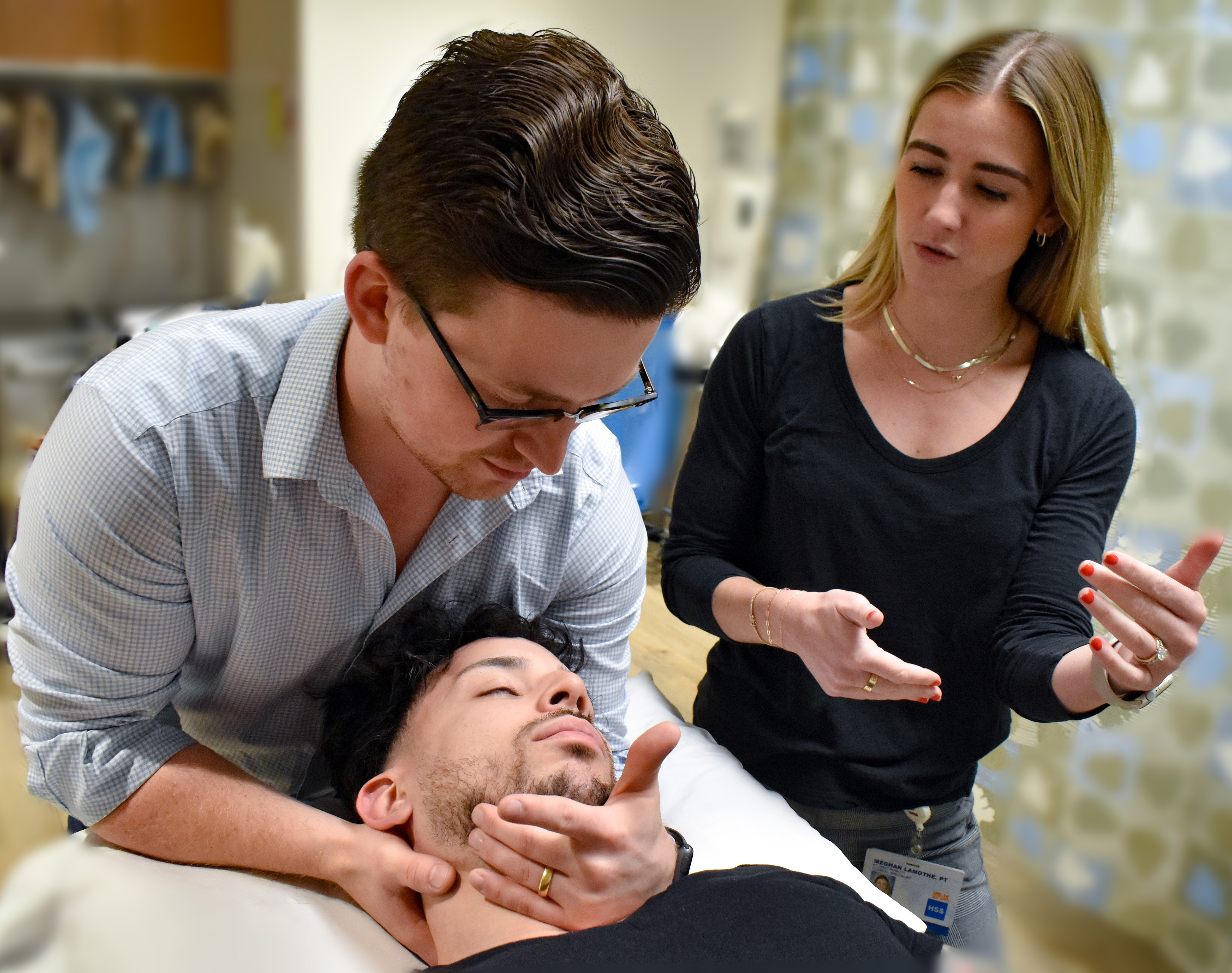 image of a clinician teaching a resident